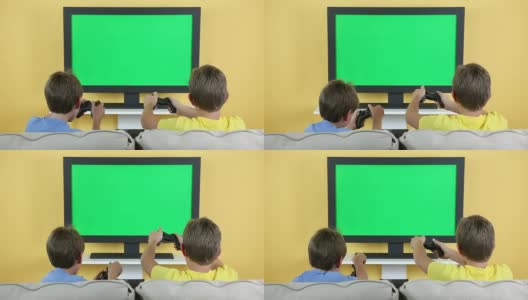 儿童玩视频游戏与彩色键电视屏幕高清在线视频素材下载