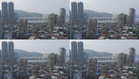 中国阳光日澳门城市景观公寓大楼屋顶海岸线全景4k高清在线视频素材下载
