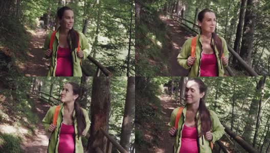 在夏季森林中观赏风景的孕妇高清在线视频素材下载