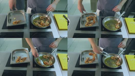 厨师的手把炸虾从锅里移到一个特殊的盘子里高清在线视频素材下载
