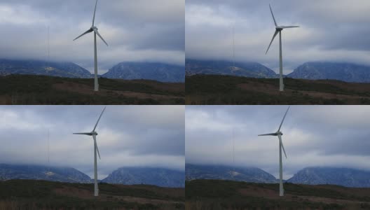 风力涡轮机与戏剧性的天空背景在比利牛斯东方高清在线视频素材下载
