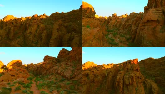 鸟瞰图通过红色的岩石峡谷在日落高清在线视频素材下载