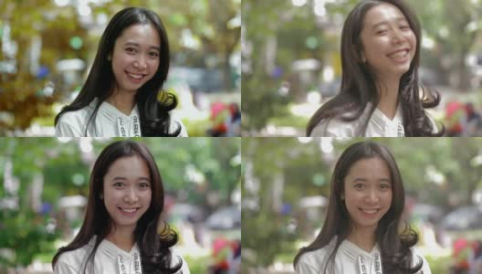 美丽的东南亚女人的肖像微笑和大笑在镜头在公园与三种色调高清在线视频素材下载
