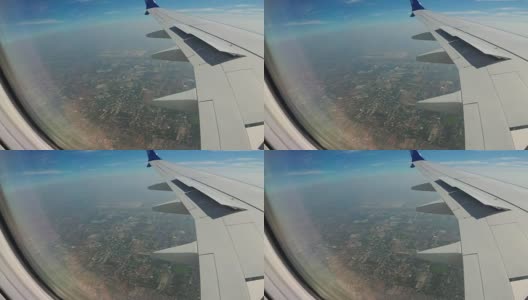 从一架喷气式飞机的窗口看曼谷的城市景观高清在线视频素材下载