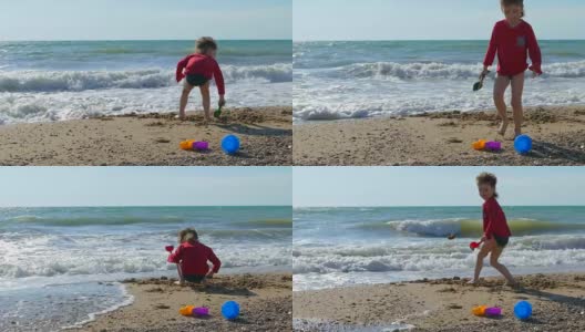 男孩在沙滩上挖沙子高清在线视频素材下载