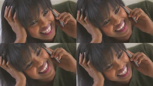 一个非洲裔美国女孩一边笑一边打电话高清在线视频素材下载
