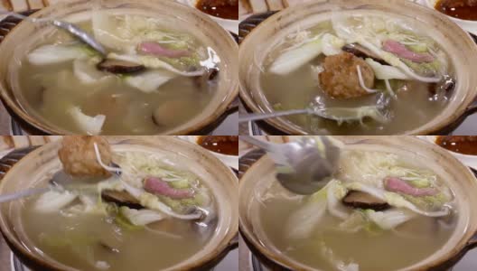 中餐馆里人们在碗里搅拌汤的动作高清在线视频素材下载