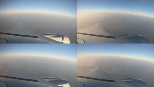 美丽的云带着飞机翅膀从窗口飞向天空。高清在线视频素材下载