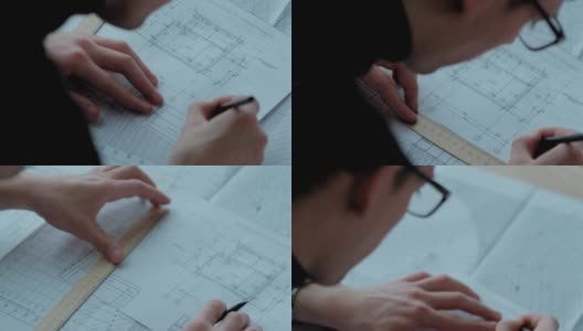 建筑师用尺子和铅笔绘制项目。近距离高清在线视频素材下载