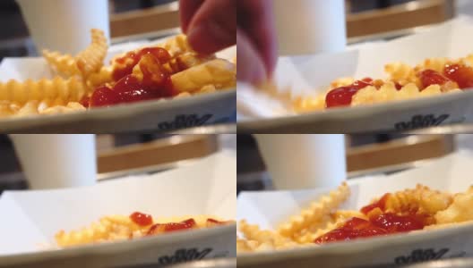吃薯条配番茄酱的薯条高清在线视频素材下载