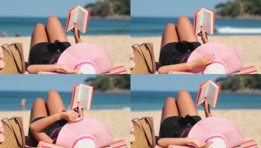 特写，女孩在沙滩上看书放松高清在线视频素材下载