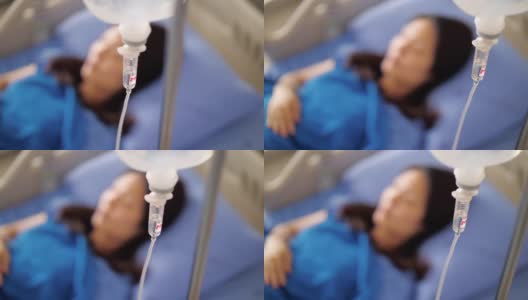 女患者在医院静脉滴注生理盐水容量泵高清在线视频素材下载