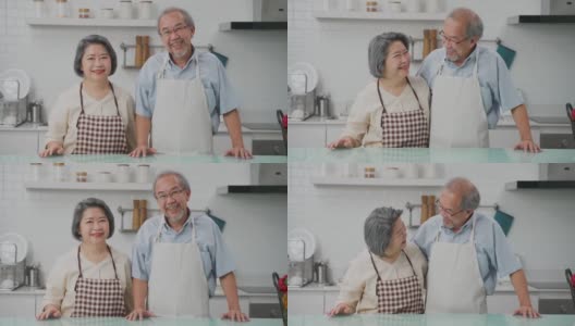 夫妇老亚洲长者幸福生活在家庭厨房。爷爷抱着奶奶幸福地笑着一起享受退休生活。老年人的家庭关系和活动概念。高清在线视频素材下载