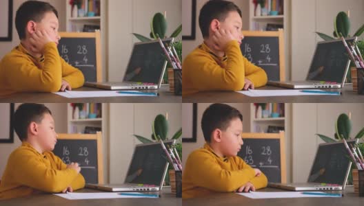 6-7岁可爱的孩子从电脑学习数学。学习在家里。在线教育高清在线视频素材下载