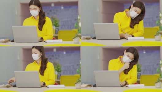 快乐的亚洲商务女性戴着面具与客户交谈，用笔记本电脑工作，并在纸上写下需求或商业计划，在现代办公室或联合办公空间，创业概念高清在线视频素材下载