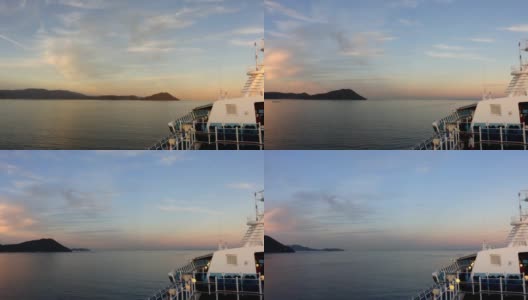 假期邮轮在日落天空中与岛屿在日本海洋中旅行的时间流逝。高清在线视频素材下载