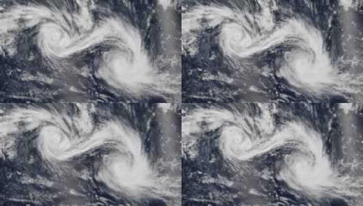 4K Cinemagraph，两个热带气旋，两个风暴在海洋中非常接近地搅动高清在线视频素材下载