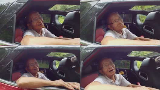 快乐的老人打开车窗，在车上看到美丽的风景，与家人享受自然之旅。祖父面带微笑，头和手伸出车窗欣赏风景。高清在线视频素材下载