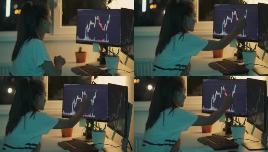 年轻女子使用台式电脑跟踪和交易加密货币高清在线视频素材下载