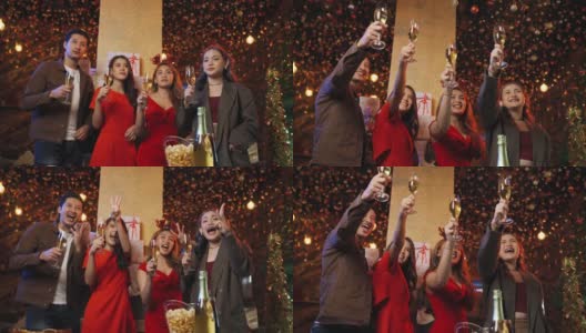 一群朋友在晚上一起庆祝新年倒计时，用香槟酒碰杯高清在线视频素材下载