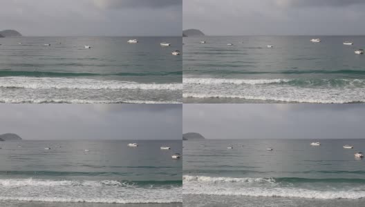 三亚海滩风光:岛屿、船、浪、浮球。高清在线视频素材下载