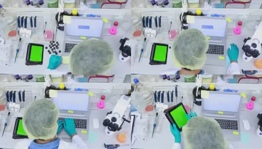 绿色屏幕与科学家在实验室工作高清在线视频素材下载