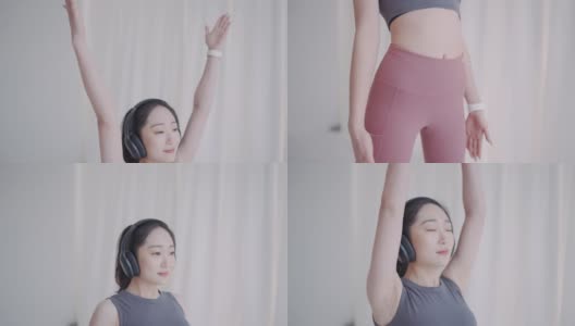 年轻的亚洲女性用无线耳机练习瑜伽冥想高清在线视频素材下载