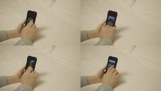 在床上玩手机高清在线视频素材下载