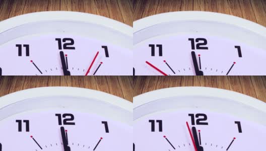一个12点钟带着一个箭头的挂钟的视频片段，用木制背景拍摄高清在线视频素材下载