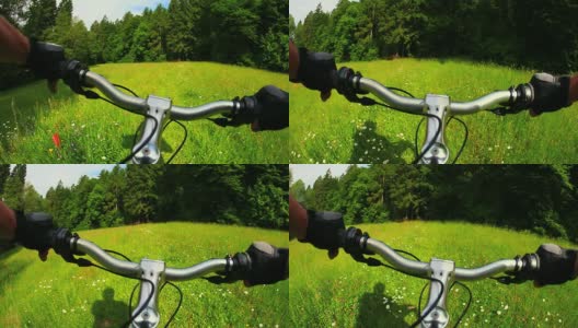 高清山地自行车在春天的草地高清在线视频素材下载