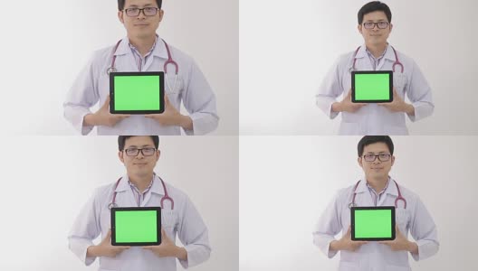 医生拿着绿色屏幕的笔记本电脑高清在线视频素材下载