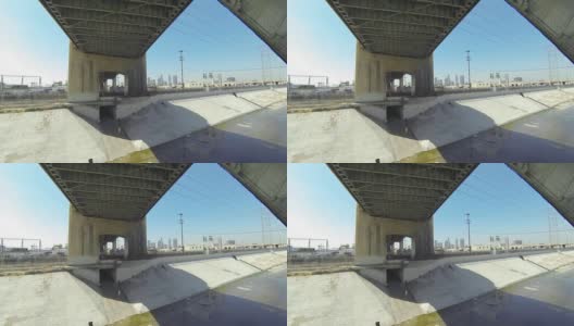 在以城市为背景的洛杉矶河大桥上飞行高清在线视频素材下载
