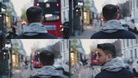 一名年轻人走在英国伦敦的大街上高清在线视频素材下载
