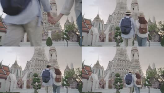 亚洲夫妇快乐的游客旅游，他们的假期和举行在泰国曼谷的阿伦寺高清在线视频素材下载