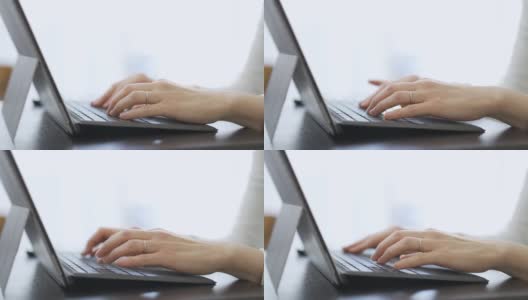 一个亚洲女人在笔记本电脑上打字的手高清在线视频素材下载