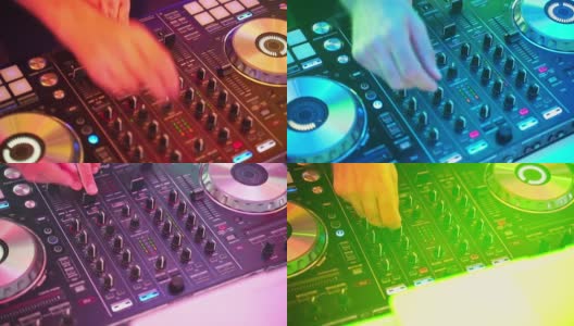 特写的DJ的双手扭动着，按下DJ遥控器上不同的按钮，颜色和轻音乐在俱乐部里。与dj派对高清在线视频素材下载