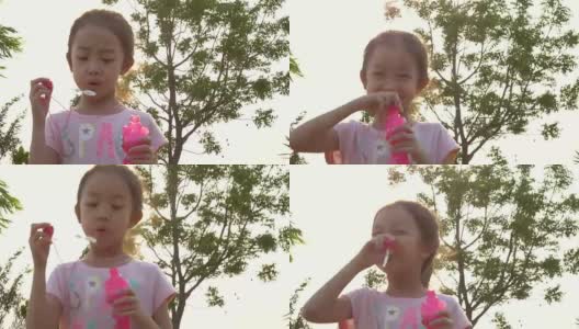 亚洲小女孩吹肥皂泡高清在线视频素材下载