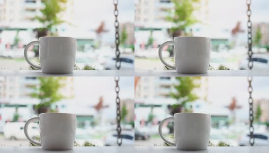 在室外大理石咖啡桌上放着一杯咖啡高清在线视频素材下载