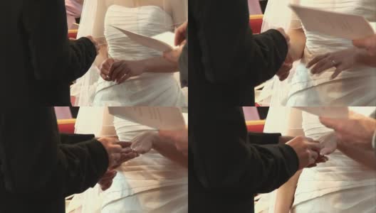 在宣誓仪式上把结婚戒指戴在新娘的手指上高清在线视频素材下载
