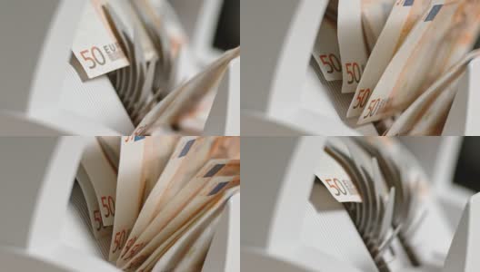 数钞机上的叶轮将50张欧元钞票推到一个堆积机上高清在线视频素材下载