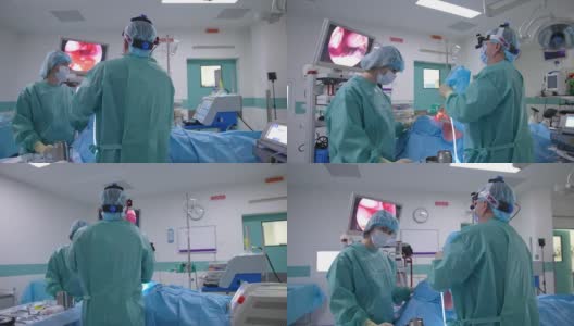 外科医生和他的助手正在进行手术。专业医生通过显示器查看病人的鼻子内部情况。高清在线视频素材下载