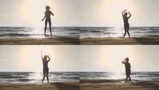 剪影女孩在海滩上的比基尼在日落，有乐趣，跳和跳舞。以120帧每秒拍摄的慢动作高清在线视频素材下载
