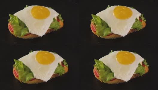 俯瞰美味的新鲜三明治，烤面包，绿色沙拉，鸡蛋，火腿高清在线视频素材下载