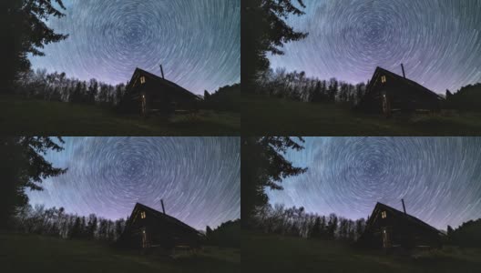 星际轨迹，银河系的恒星轨迹在夜空森林自然中古老的木屋上旋转高清在线视频素材下载