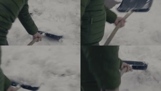 在人行道上铲雪的男人高清在线视频素材下载