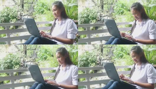 女人的手在露台上使用电脑高清在线视频素材下载