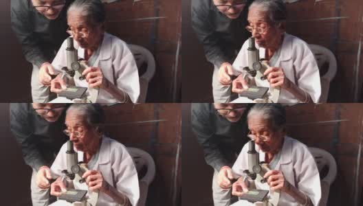老妇人在找显微镜，高清在线视频素材下载