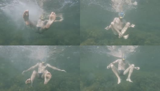 戴面具戴通气管的大胡子男人在水下鬼混高清在线视频素材下载
