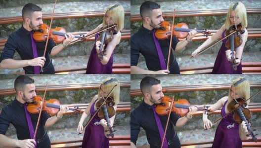 音乐二人组演奏小提琴高清在线视频素材下载