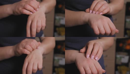 一个皮肤干燥的糖尿病妇女抓挠她的手的特写镜头。高清在线视频素材下载